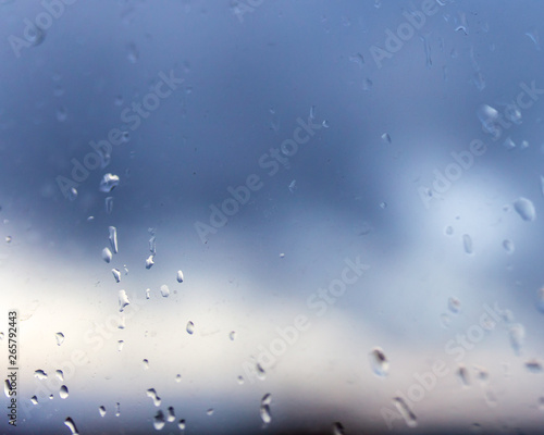 Drops from the rain on the glass window as a background