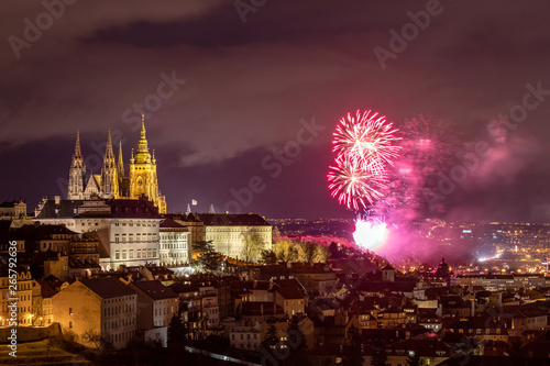 Fireworks over the Old Town of Prague  Czech Republic. New Year fireworks in Prague  Czechia. Prague fireworks during New Year Celebration near St. Vitus Cathedral  Prague  Czech republic.