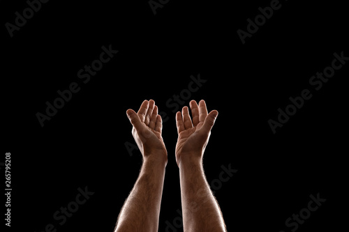 Male hands closeup isolated on black background