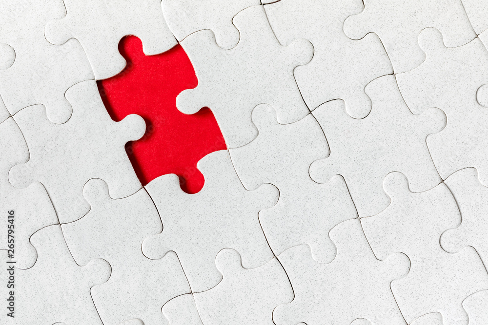 Unfinished white jigsaw puzzle pieces. Fill in pieces of the jigsaw puzzle. Complete the jigsaw puzzle with the missing pieces. Fragment of a folded white jigsaw puzzle. Unfinished white jigsaw puzzle pieces. Fill in pieces of the jigsaw puzzle. Complete the jigsaw puzzle with the missing pieces. Fragment of a folded white jigsaw puzzle.