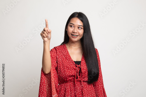 Asian woman touching the screen with finger.