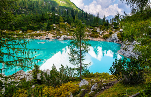 Amazing view of famous lake Sorapis with turquoise water. Best popular location for photography and hiking in Dolomites Alps. Italy, Europe. Artistic picture. Beauty world