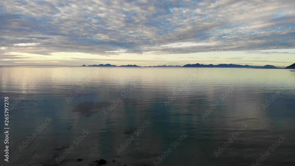 Coast of Gimsoya island, seascape in Gimsoysand in summer, midnight sun. Nordland county, Lofoten archipelago Norway. Tourist attraction Coast of Gimsoya island, seascape in Gimsoysand in summer, midnight sun. Nordland county, Lofoten archipelago Norway. Tourist attraction