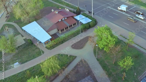 Aerial view of a wooden church with a large golden cross near the wide river Dnieper in Kiev photo