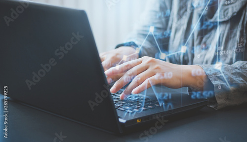Closeup young businesswoman typing on keyboard laptop