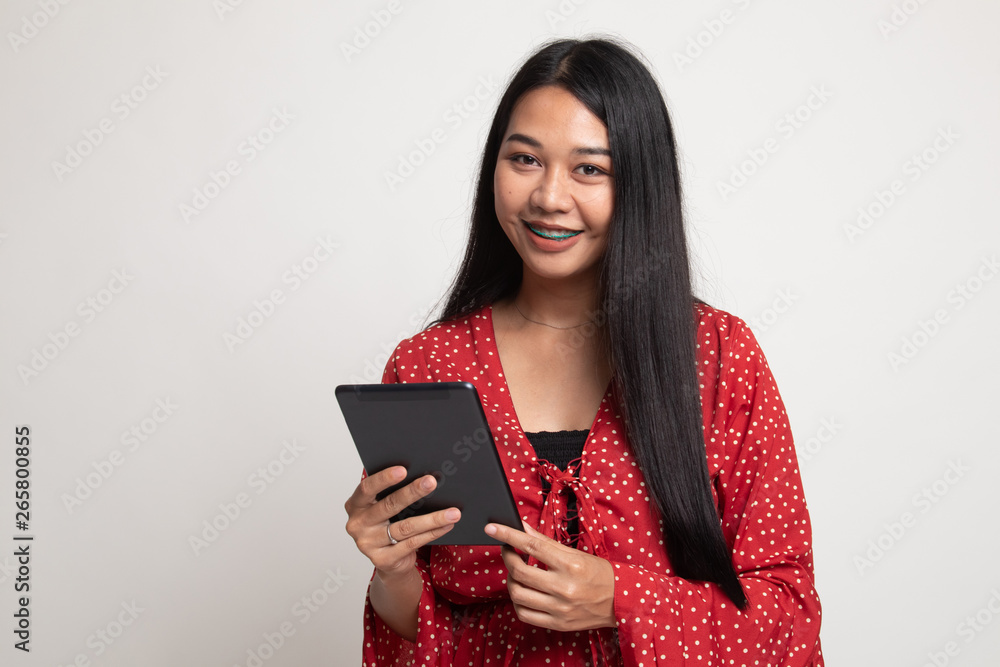 Young Asian woman with a computer tablet. Young Asian woman with a computer tablet.