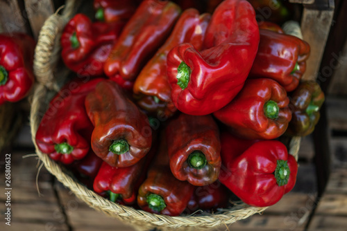 Organic fresh agricultural product at farmer market. Organic, agriculture products. Freshly, seasonal harvested vegetables. Bio, healthy food. Vegetarian food. Ripe organic paprika in a basket.