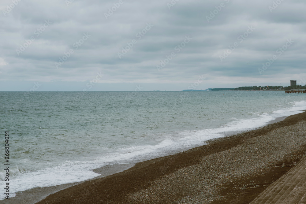 Deserted, empty sandy beach, grey sky and clouds, autumn storm. Deserted, empty sandy beach, grey sky and clouds, autumn storm.