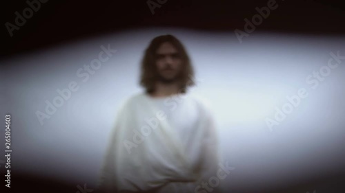 POV of person dying and looking at Jesus in light, God welcoming man to heaven