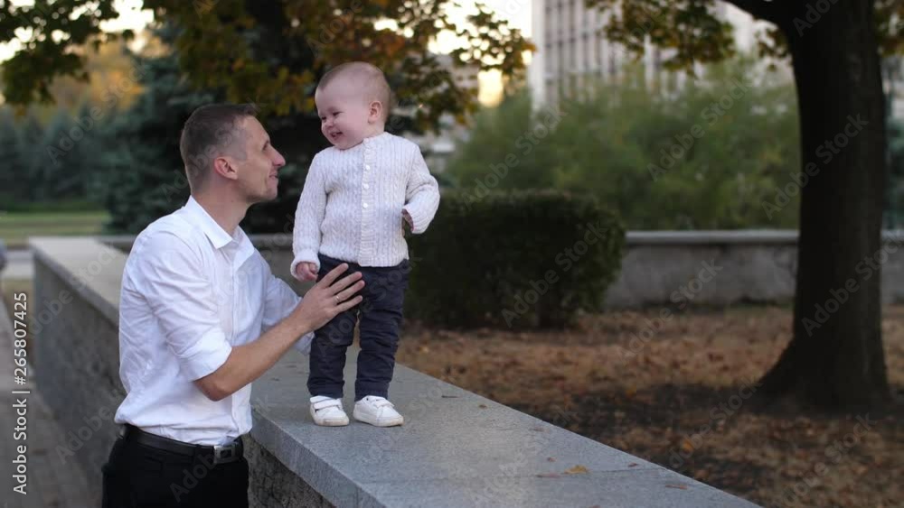 Father wakling with the baby Father wakling with the baby