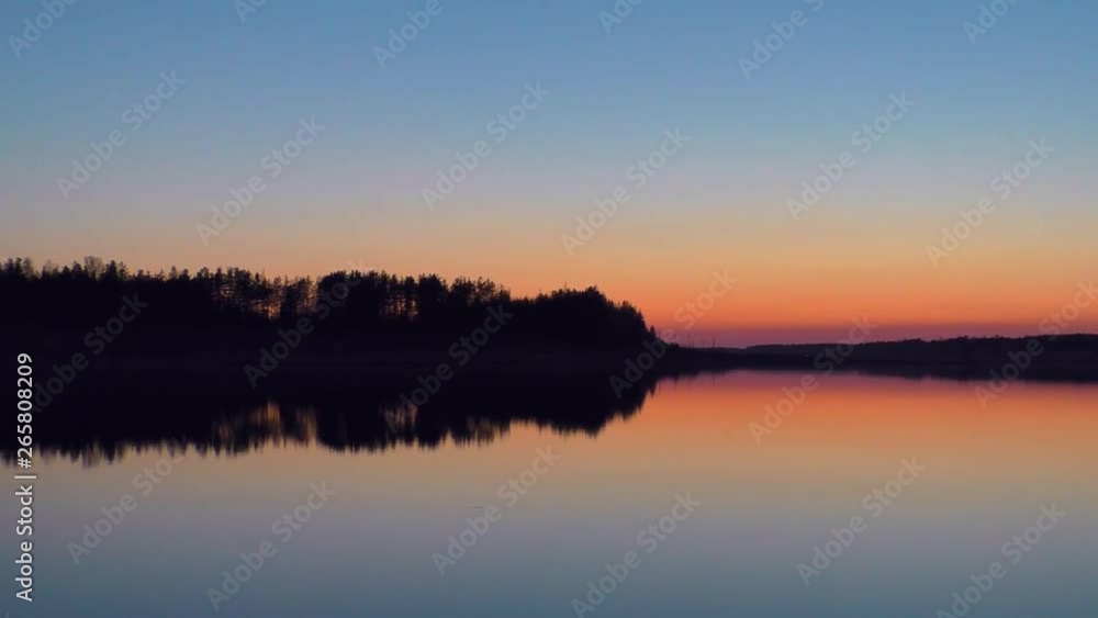 Landscape lake at sunset in the evening. Idyllic tranquil scene of a mysterious nature. Landscape lake at sunset in the evening. Idyllic tranquil scene of a mysterious nature.
