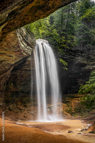 Ash Cave Falls - In the Hocking Hills of Ohio, a beautiful, tall, free-falling waterfall graces Ash Cave, an enormous recess cave with an overhanging cliff of Black Hand Sandstone.