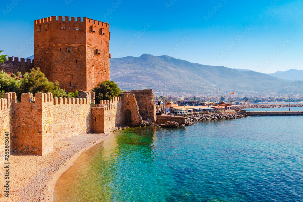 Landscape of ancient shipyard near of Kizil Kule tower in Alanya peninsula, Antalya district, Turkey, Asia. Famous tourist destination with high mountains. Part of ancient old Castle.