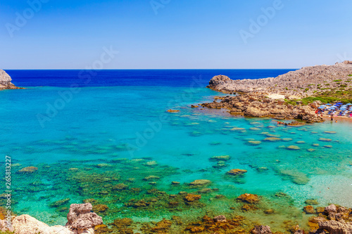 Sea skyview landscape photo Ladiko bay near Anthony Quinn bay on Rhodes island, Dodecanese, Greece. Panorama with nice sand beach and clear blue water. Famous tourist destination in South Europe