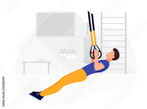 Fit man working out on trx doing bodyweight exercises. Fitness strength training workout.