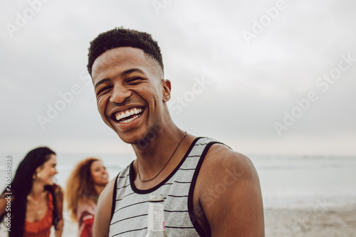Handsome young african man on the beach
