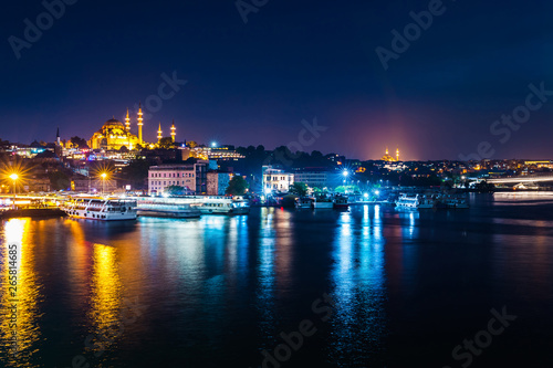 Night view of Istanbul. Panorama cityscape of famous tourist destination Golden Horn bay part of Bosphorus strait. Travel illuminated landscape Bosporus  Turkey  Europe and Asia.