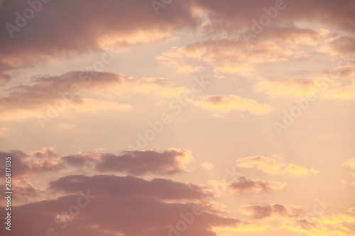 Golden cumulus sunset clouds background