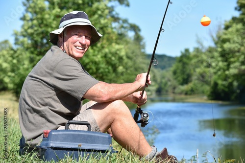 Sportsman And Happiness With Fishing Rod Outdoors