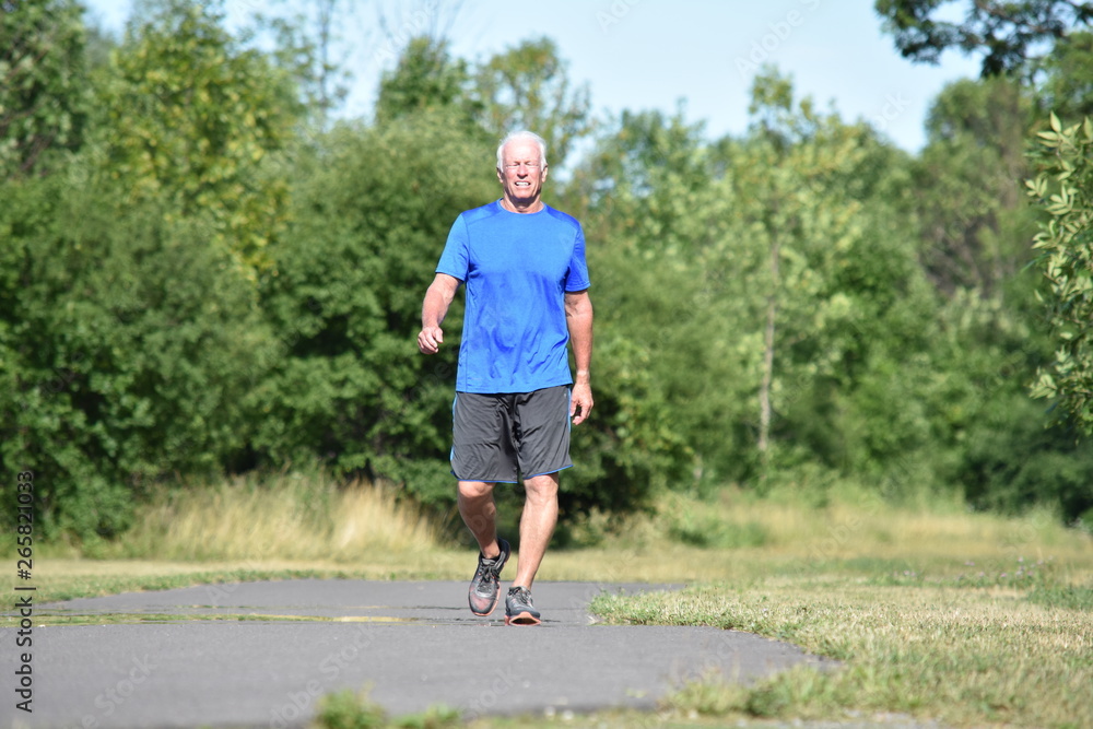 Fototapeta premium Old Male Senior Smiling Wearing Sneakers Exercising