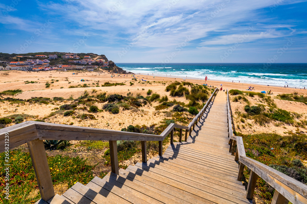 Fototapeta premium View of the Monte Clerigo beach on the western coastline of Portugal, Algarve. Stairs to beach Praia Monte Clerigo near Aljezur, Costa Vicentina, Portugal, Europe.