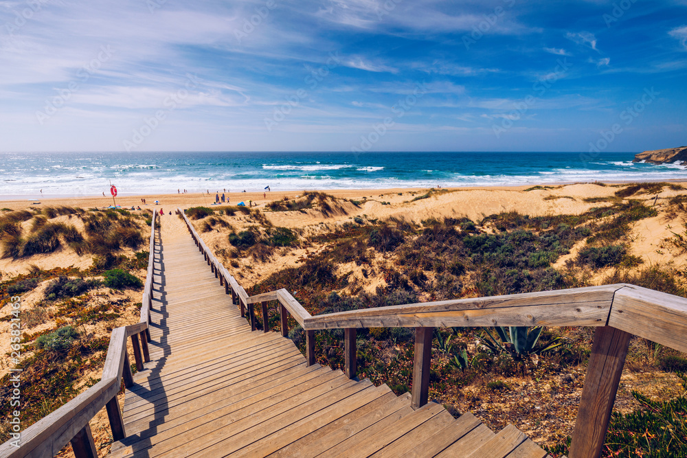 View of the Monte Clerigo beach on the western coastline of Portugal, Algarve. Stairs to beach Praia Monte Clerigo near Aljezur, Costa Vicentina, Portugal, Europe.