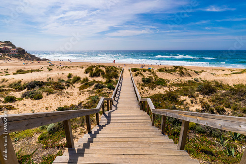 View of the Monte Clerigo beach on the western coastline of Portugal, Algarve. Stairs to beach Praia Monte Clerigo near Aljezur, Costa Vicentina, Portugal, Europe.