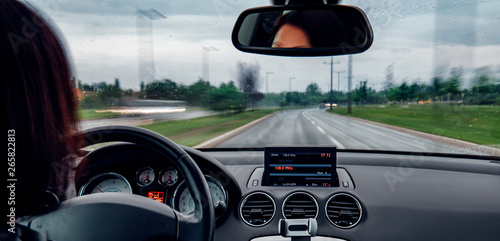 Woman driving car in highway photo