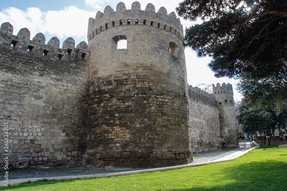 Baku, Azerbaijan: April 15, 2017: Medieval walls of a stone fortress in the old city of the capital. Baku, Azerbaijan: April 15, 2017: Medieval walls of a stone fortress in the old city of the capital.