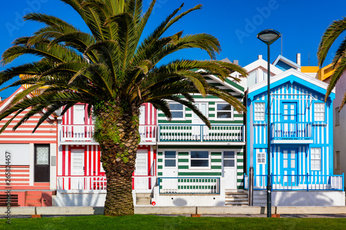 Street with colorful houses in Costa Nova, Aveiro, Portugal. Street with striped houses, Costa Nova, Aveiro, Portugal. Facades of colorful houses in Costa Nova, Aveiro, Portugal.