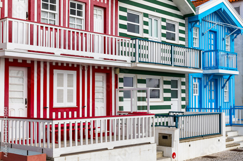 Street with colorful houses in Costa Nova, Aveiro, Portugal. Street with striped houses, Costa Nova, Aveiro, Portugal. Facades of colorful houses in Costa Nova, Aveiro, Portugal.