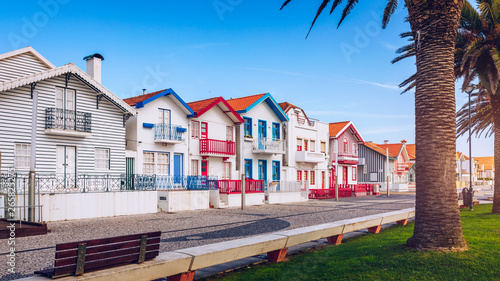 Street with colorful houses in Costa Nova, Aveiro, Portugal. Street with striped houses, Costa Nova, Aveiro, Portugal. Facades of colorful houses in Costa Nova, Aveiro, Portugal.