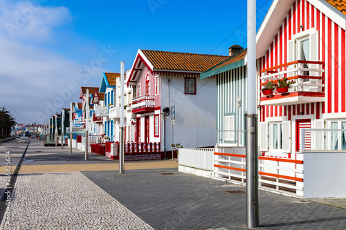 Street with colorful houses in Costa Nova, Aveiro, Portugal. Street with striped houses, Costa Nova, Aveiro, Portugal. Facades of colorful houses in Costa Nova, Aveiro, Portugal.