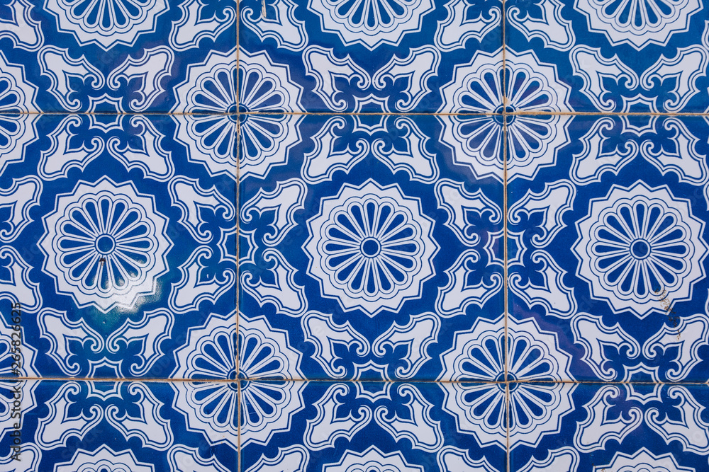 Azulejo is a form of Portuguese or Spanish painted, tin-glazed, ceramic tile work. Azulejos is traditional Portugese tiles in Aveiro. Architecture ornament. Aveiro, Portugal. Azulejo is a form of Portuguese or Spanish painted, tin-glazed, ceramic tile work. Azulejos is traditional Portugese tiles in Aveiro. Architecture ornament. Aveiro, Portugal.