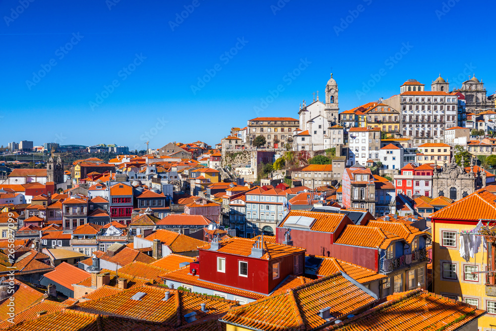 Naklejka premium Panoramic view of Old city of Porto (Oporto) and Ribeira over Douro river, Portugal. Concept of world travel, sightseeing and tourism.