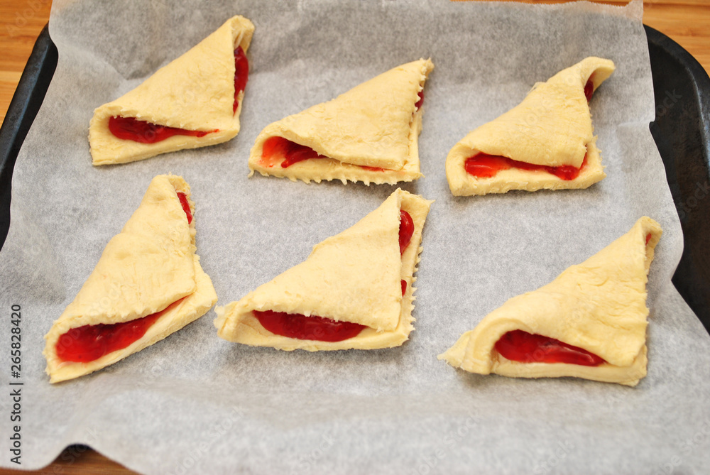 Uncooked Pastry with Preserves on a Baking Sheet Uncooked Pastry with Preserves on a Baking Sheet