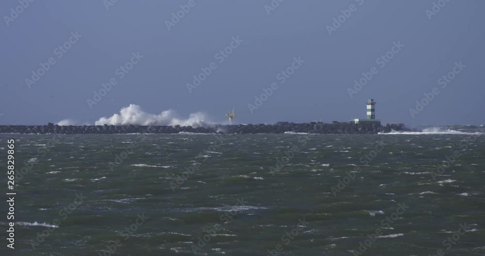 breakwater during storm, pilot vessel and high waves breakwater during storm, pilot vessel and high waves