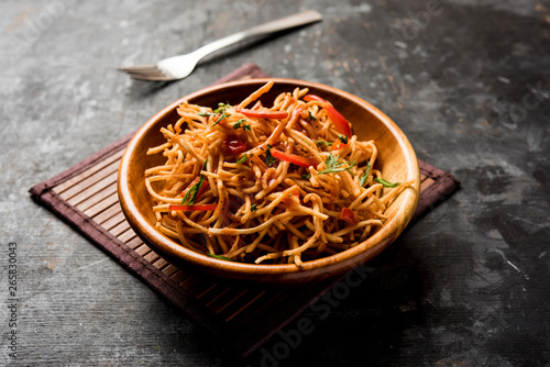 Chinese Bhel is a spicy indo-chinese recipe, served in a bowl. selective focus