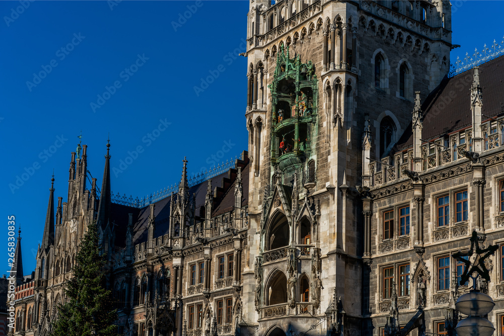 Town Hall with a Christmas tree on a bright winter day in the central historical square of Munich, Germany.
