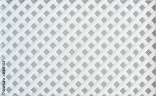 White, wooden, decorative lattice, weave the wooden slats together.