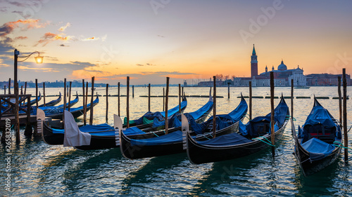 Sunrise in San Marco square, Venice, Italy. Venice Grand Canal. Architecture and landmarks of Venice. Venice postcard with Venice gondolas © daliu