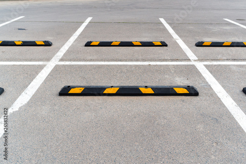 Modern rubber barrier fence for cars on parking
