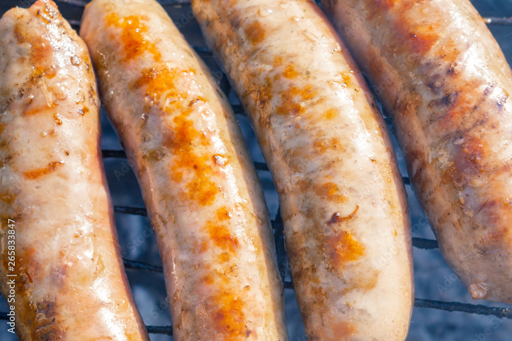bratwurst, fried sausages on the grill bratwurst, fried sausages on the grill