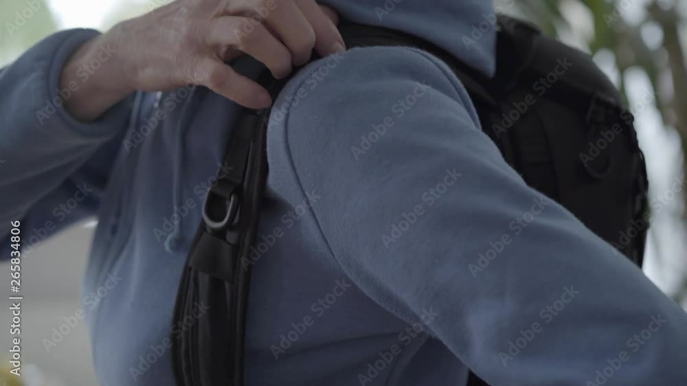 Wrinkly arms fixing backpack at the back Wrinkly arms fixing backpack at the back