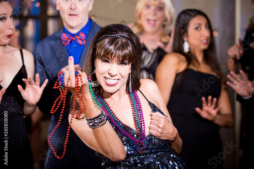 Fototapeta Obnoxious Woman at a Party Threatens to Expose her Breast