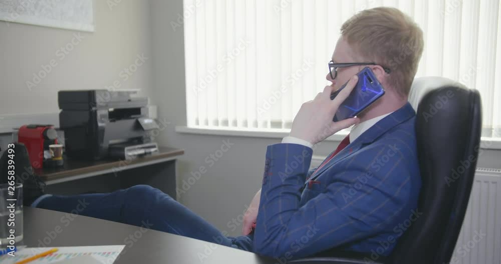 businessman talks on smartphone. businessman talks on smartphone.