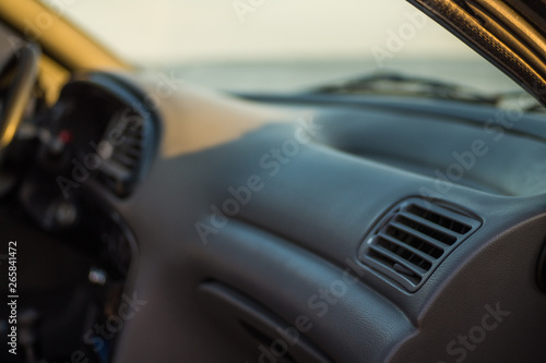 Salon inside the car, transmission with driver's steering wheel and ignition key photo