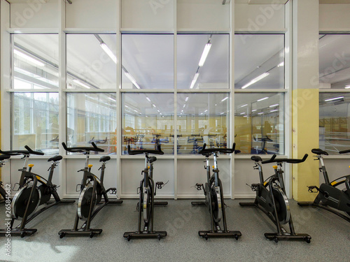 Exercise bike on the background of the glass wall