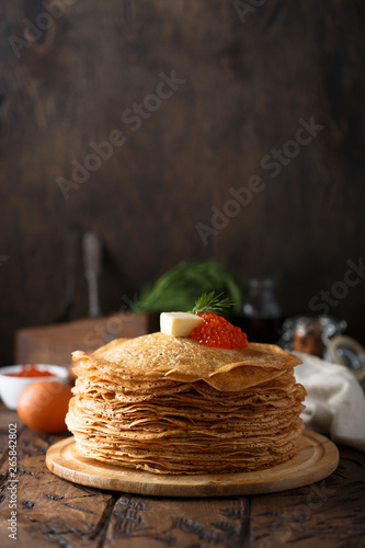 Fotografie, Obraz Traditional Russian pancakes with butter and red caviar