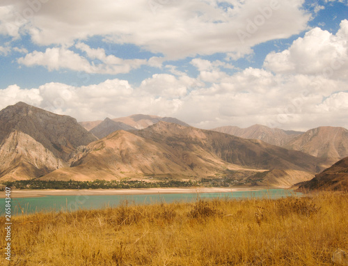 landscape with lake and mountain views. Uzbekistan, Charvak reservoir. Nature of Central Asia © warloka79